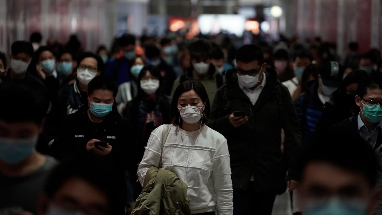 Photo of people wearing protective masks at a subway station in Hong Kong