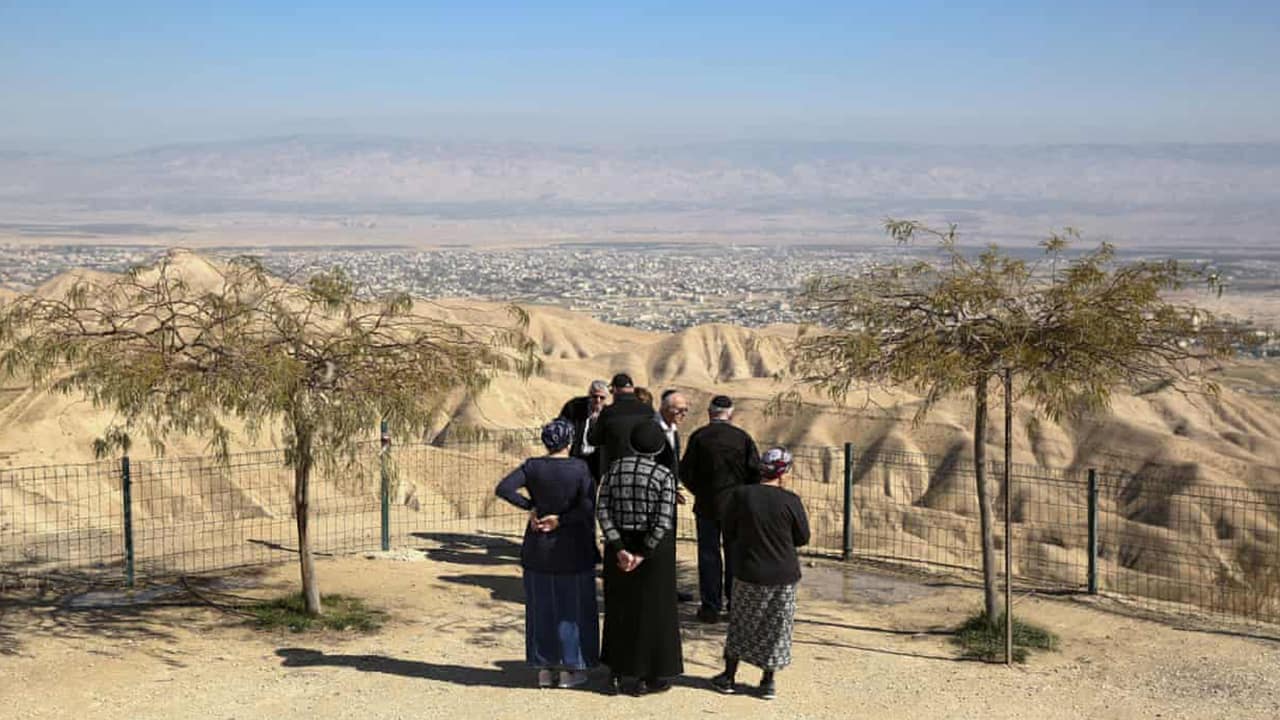 Photo of Jewish settlers overlooking Jericho