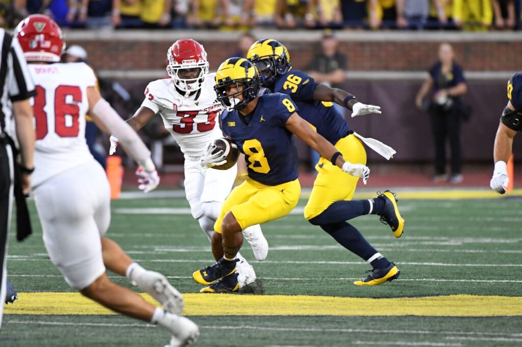 Michigan's Tyler Morris (8) returns a punt against Fresno State in the first half of an NCAA college football game, Saturday, Aug. 31, 2024, in Ann Arbor, Mich. (AP Photo/Jose Juarez)