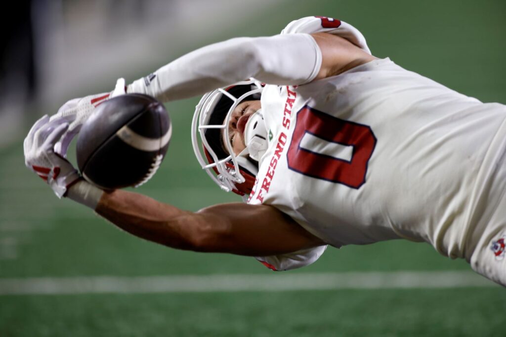 Fresno State wide receiver Mac Dalena is unable to pull in a pass in the end zone during the second quarter of an NCAA college football game against Michigan, Saturday, Aug. 31, 2024, in Ann Arbor, Mich. (AP Photo/Al Goldis)