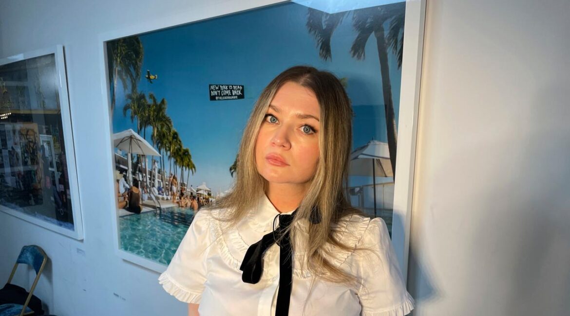 FILE - Anna Delvey, also known as Anna Sorokin, poses at her apartment in New York, May 26, 2023, to promote her podcast, "The Anna Delvey Show." (AP Photo/John Carucci, File)