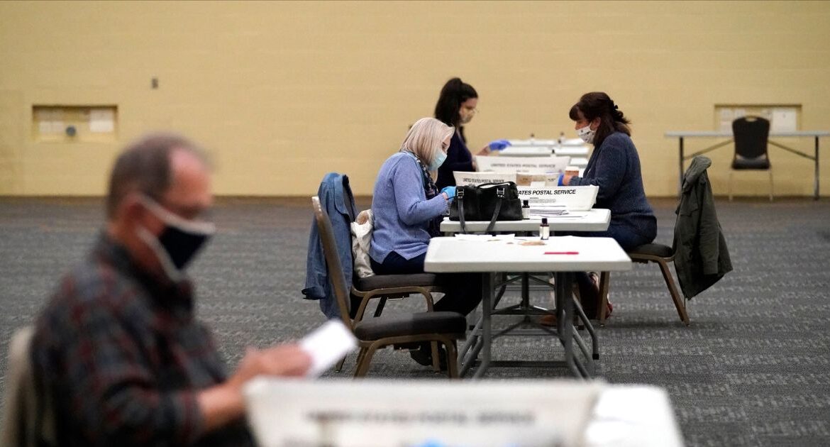 Workers prepare mail-in ballots for counting, Nov. 4, 2020, at the convention center in Lancaster, Pa. (AP File)