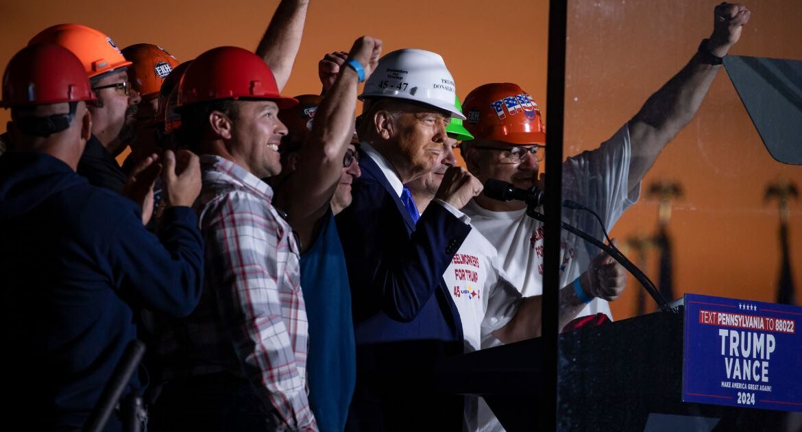 Former President Donald Trump speaks alongside steelworkers during a campaign rally at Arnold Palmer Regional Airport in Latrobe, Pa., Oct. 19, 2024. (Damon Winter/The New York Times)