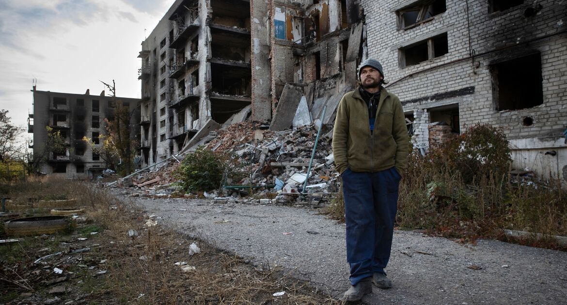 A resident outside an apartment complex that was destroyed by Russian bombardment in Siversk, in Ukraine, Oct. 30, 2024. (Tyler Hicks/The New York Times)
