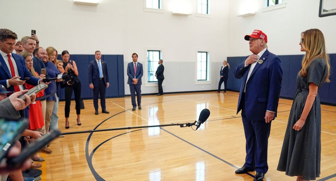 Republican presidential nominee former President Donald Trump speaks as former first lady Melania Trump listens after they voted on Election Day at the Morton and Barbara Mandel Recreation Center, Tuesday, Nov. 5, 2024, in Palm Beach, Fla. (AP Photo/Evan Vucci)