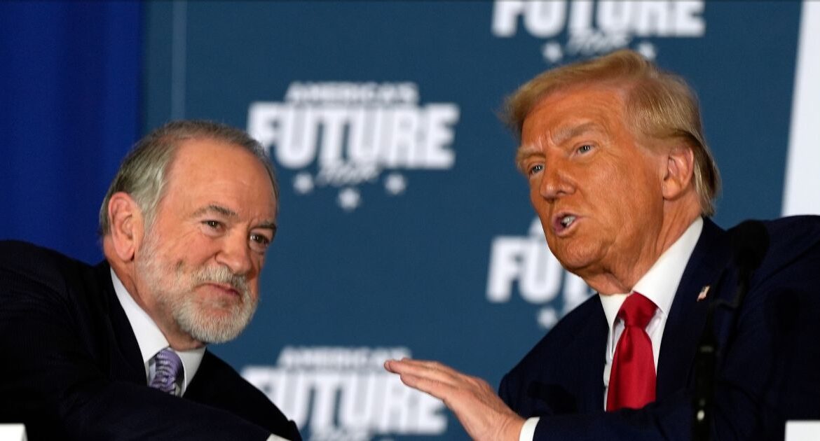 Republican presidential nominee former President Donald Trump talks with former Arkansas Gov. Mike Huckabee during a roundtable at the Drexelbrook Catering & Event Center, Tuesday, Oct. 29, 2024, in Drexel Hill, Pa. (AP Photo/Julia Demaree Nikhinson)