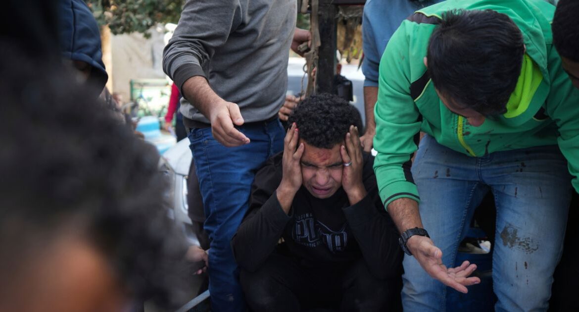 Palestinians mourn their relatives killed in the Israeli bombardment of Maghazi in the Gaza Strip, during their funeral at a hospital morgue in Deir al-Balah, Gaza, Thursday, Nov. 14, 2024. (AP/Abdel Kareem Hana)
