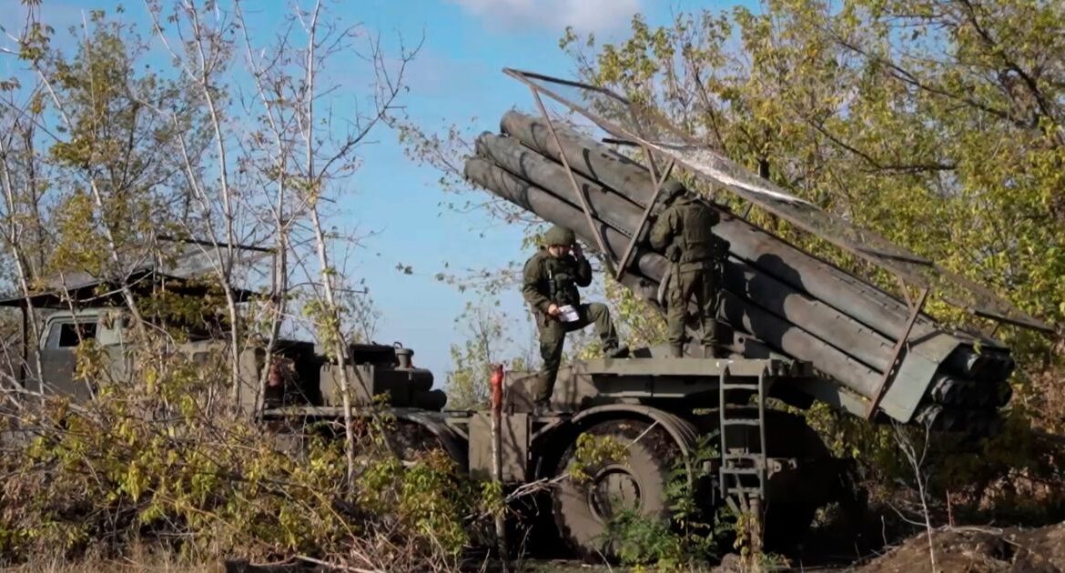In this photo taken from a video released by Russian Defense Ministry press service on Monday, Nov. 25, 2024, Russian servicemen operate a Russian Uragan self-propelled multiple rocket launcher in an undisclosed location. (Russian Defense Ministry Press Service via AP)