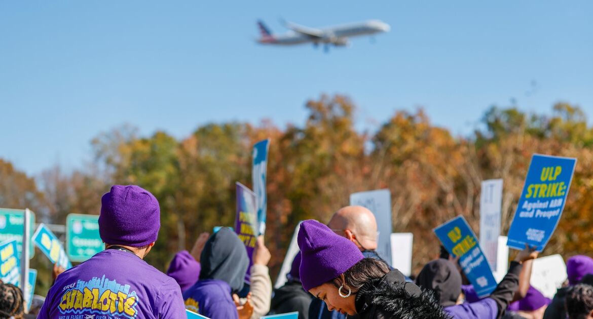 An airplane arrives at Charlotte Douglas International Airport as airport workers strike in front of the Charlotte Douglas International Airport in Charlotte, N.C., Monday, Nov. 25, 2024. (AP/Nell Redmond)