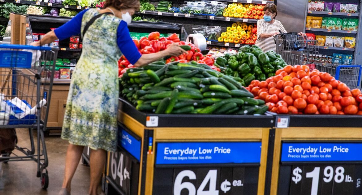 People buy groceries at a Walmart Superstore in Secaucus, New Jersey, July 11, 2024. (AP Photo/Eduardo Munoz Alvarez, File)