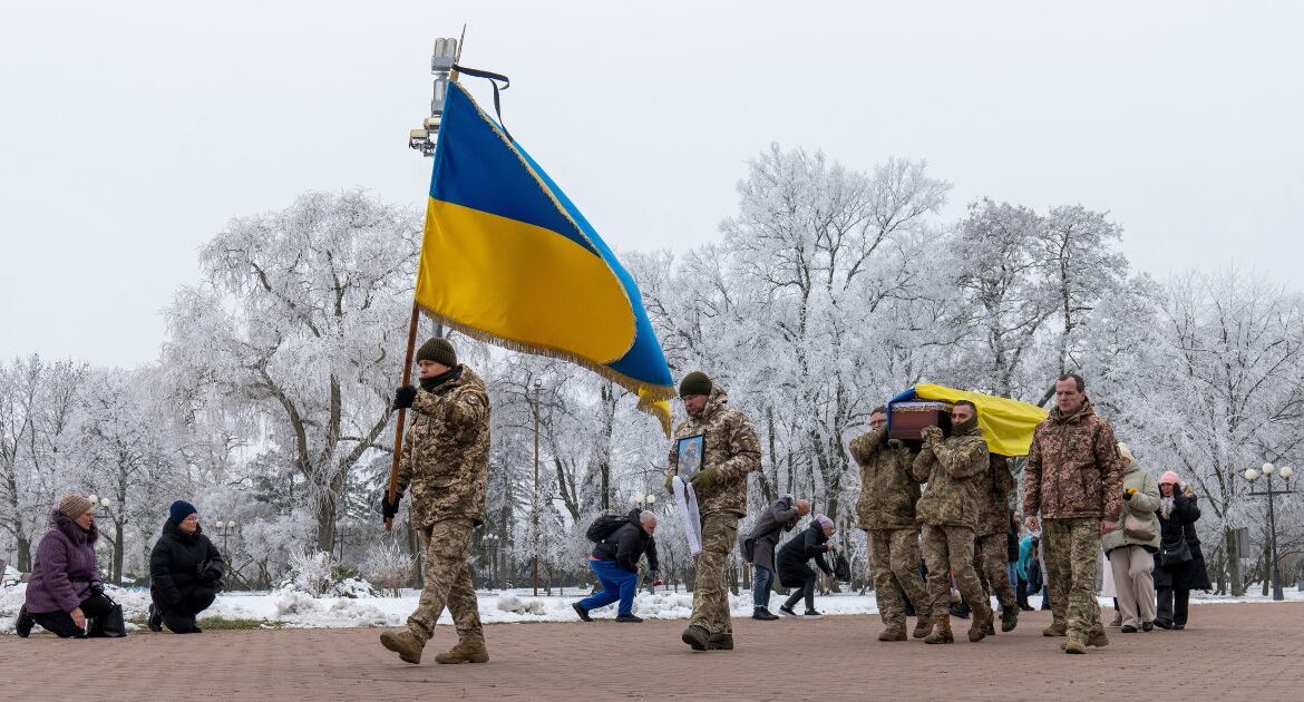 Fellow soldiers carry a coffin of leading actor of the music and drama theatre Petro Velykiy, 48, who was killed in a battle with the Russian troops in Russia's Kursk region, during farewell ceremony in Chernyhiv, Ukraine, Wednesday, Nov. 27, 2024.(AP/Dan Bashakov)