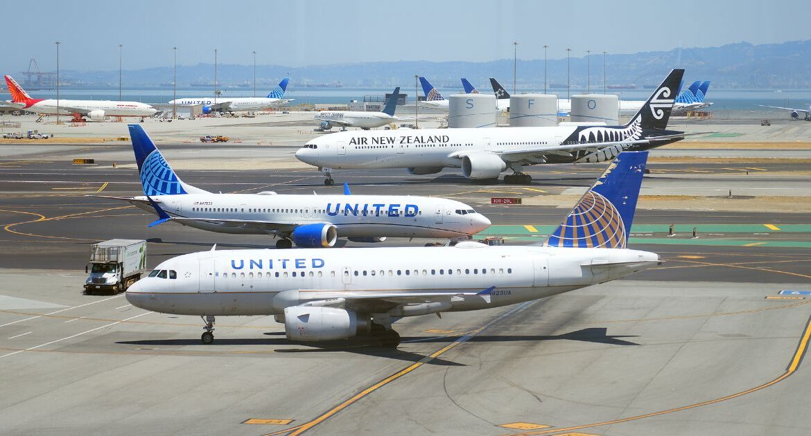 Planes on the tarmac at San Francisco International Airport, July 19, 2024. Why do today’s flights arrive early more often, even though they’re slower? Airlines have extended their scheduled flight durations even more than the flights have lengthened in actual duration. (Jim Wilson/The New York Times)