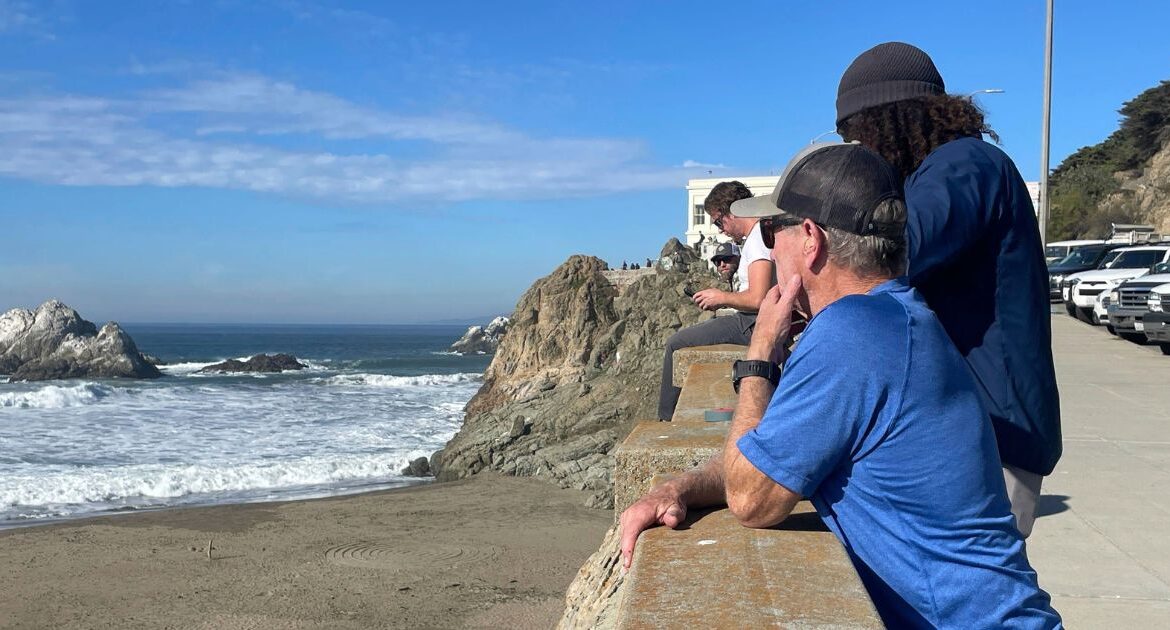 People watch the waves come in after an earthquake was felt widely across Northern California at Ocean Beach in San Francisco, Thursday, Dec. 5, 2024. (AP Photo/Haven Daley)