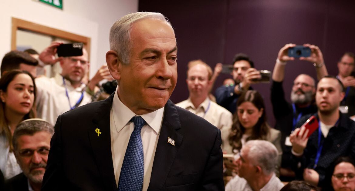 Israeli Prime Minister Benjamin Netanyahu arrives at the district court for his long-running trial for alleged corruption, in Tel Aviv, Israel, Tuesday, Dec. 10, 2024. (Menahem Kahana/Pool Photo via AP)