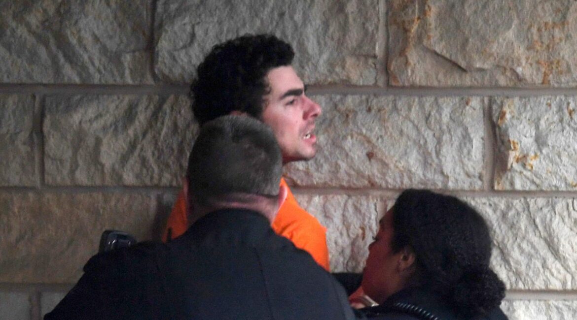 Luigi Nicholas Mangione is escorted into Blair County Courthouse, Tuesday, Dec. 10, 2024, in Hollidaysburg, Pa. (AP Photo/Gary M. Baranec)