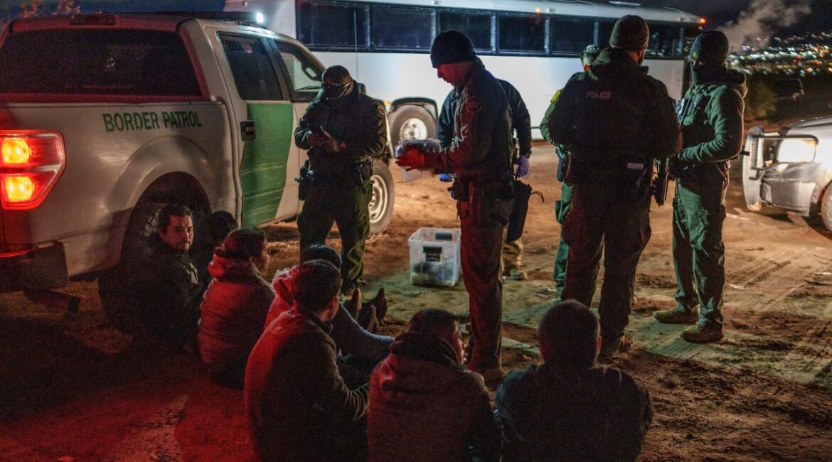 Migrants are processed after being apprehended by U.S. Border Patrol agents on the U.S.-Mexico border in Sunland Park, N.M., on Nov. 4, 2024. The incoming administration said it will not rely on outside groups to carry out its plan to deport millions of immigrants, but militias have a long record of inserting themselves into patrolling the border. (Paul Ratje/The New York Times)
