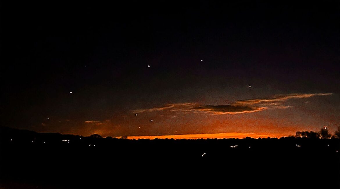 This photo provided by Trisha Bushey shows the evening sky and points of light near in Lebanon Township, N.J., on Thursday, Dec. 5, 2024. (Trisha Bushey via AP)