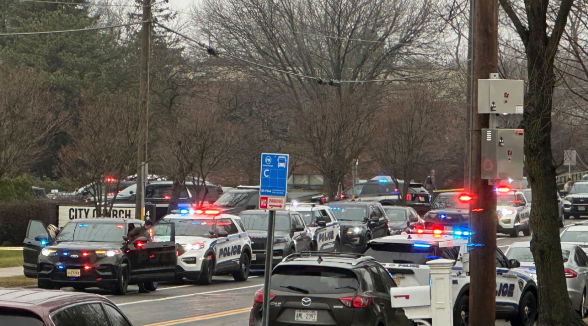 Emergency vehicles are parked outside the Abundant Life Christian School in Madison, Wis., where multiple injuries were reported following a shooting, Monday, Dec. 16, 2024. (AP/Scott Bauer)