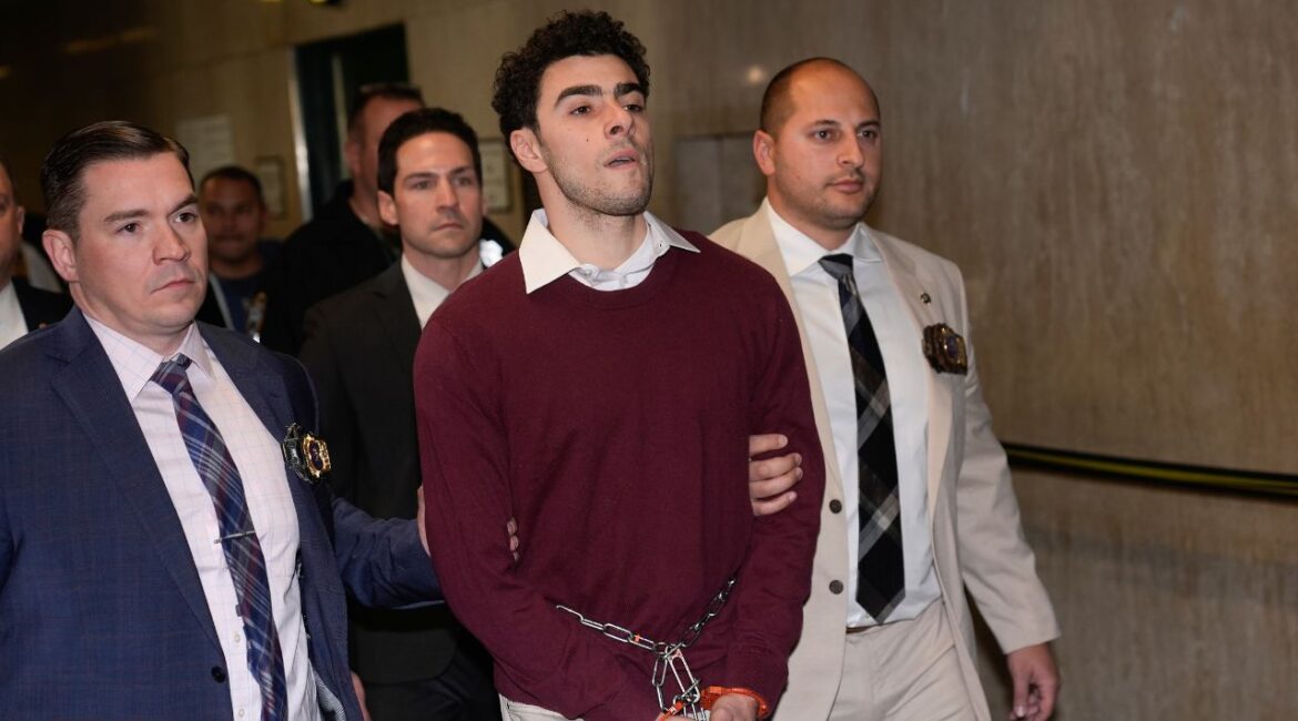 Luigi Mangione is escorted into Manhattan Criminal court for his arraignment on state murder and terror charges in the killing of UnitedHealthcare CEO Brian Thompson, Monday, Dec. 23, 2024, in New York. (AP/Seth Wenig)