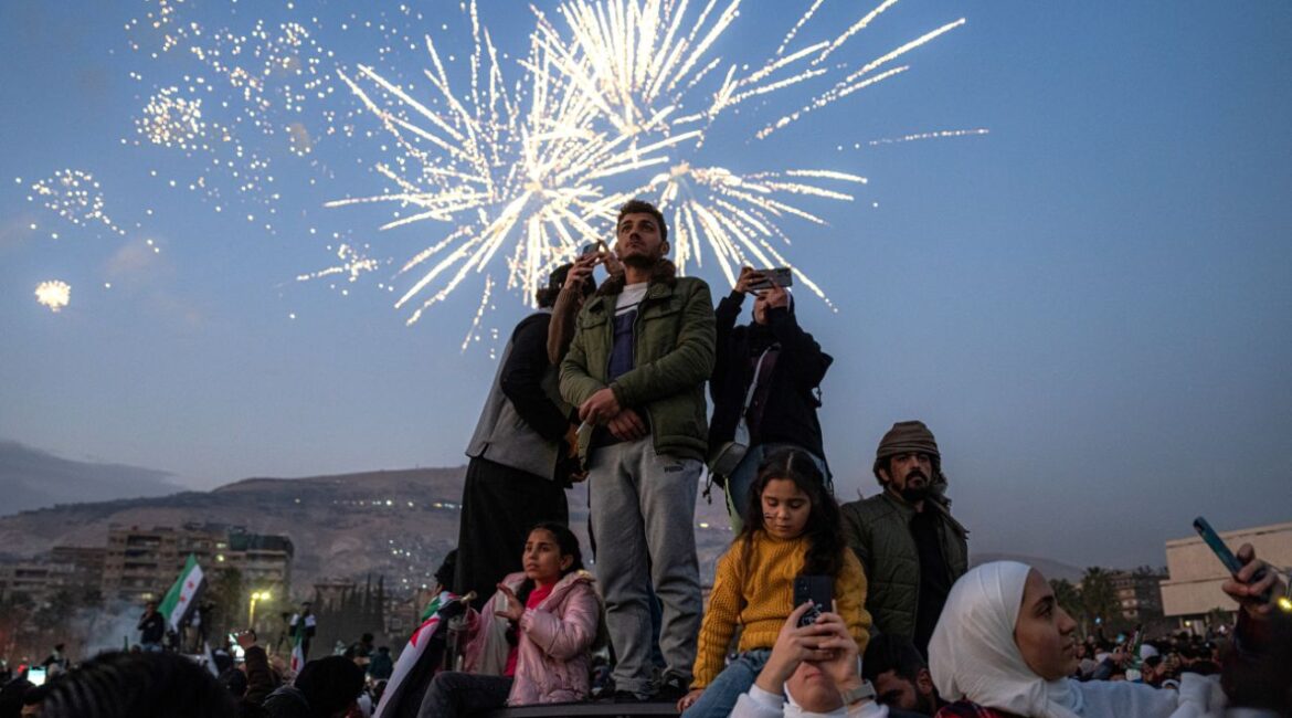 Syrians gather in Damascus on Friday evening, Dec. 20, 2024. Celebrations continue over the fall of the Assad regime earlier this month. Ministers from Jordan and Qatar were among the first high-ranking Arab diplomats to meet with the leader of the rebel coalition that toppled the Syrian regime two weeks ago. (Daniel Berehulak/The New York Times)