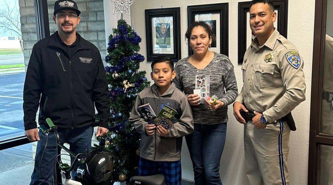 Axel Hernandez Franco (middle), 9, is recovering from a school zone crash received a bike and safety training from CHP Madera. (CHP Madera)