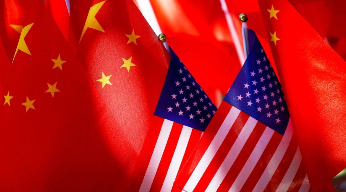 American flags are displayed with Chinese flags on top of a trishaw on Sept. 16, 2018, in Beijing. (AP File)