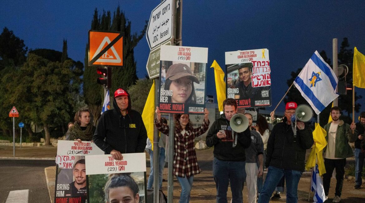 Israeli demonstrators outside the prime minister's office in Jerusalem hold photos of Liri Albag and other hostages during a protest calling for their release from being held in the Gaza Strip by the Hamas militant group, Sunday, Jan. 5, 2025. (AP/Ohad Zwigenberg)