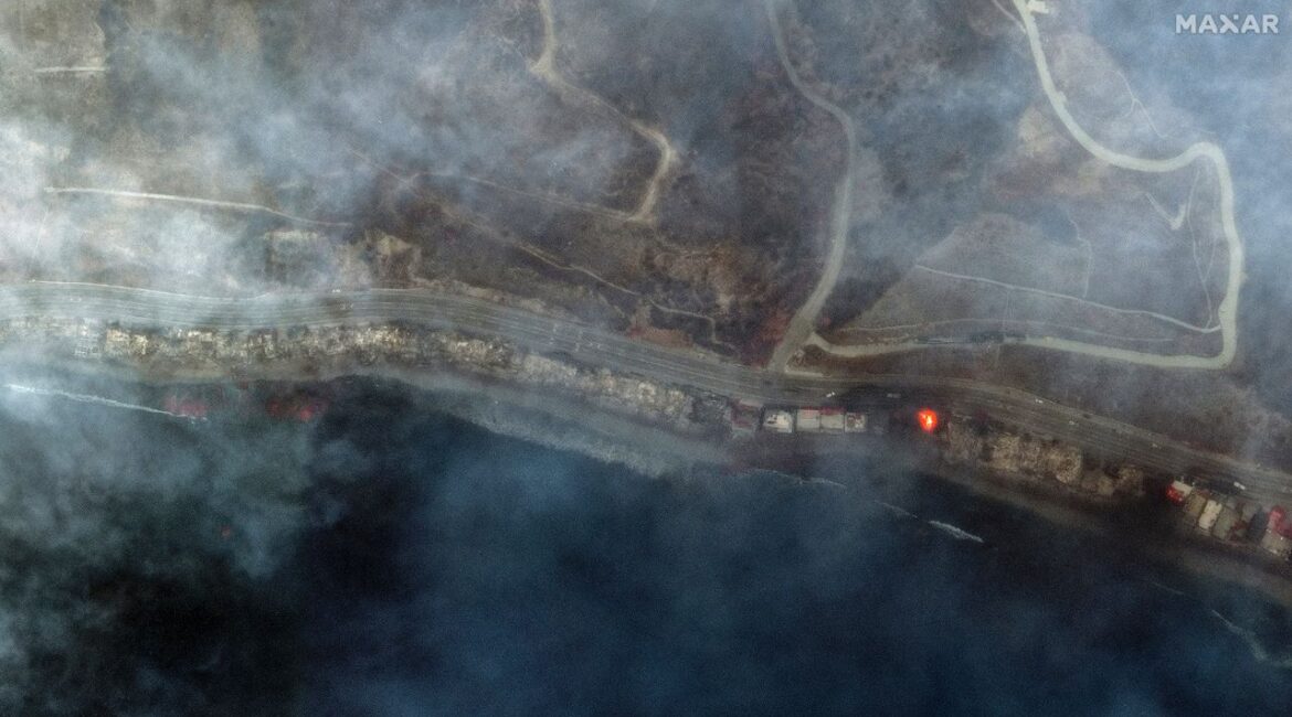 This infrared satellite image provided by Maxar Technologies shows burned structures and active fire burning from the Palisades Fire in Tuna Canyon Wednesday, Jan. 8, 2025, in Los Angeles. (Maxar Technologies via AP)
