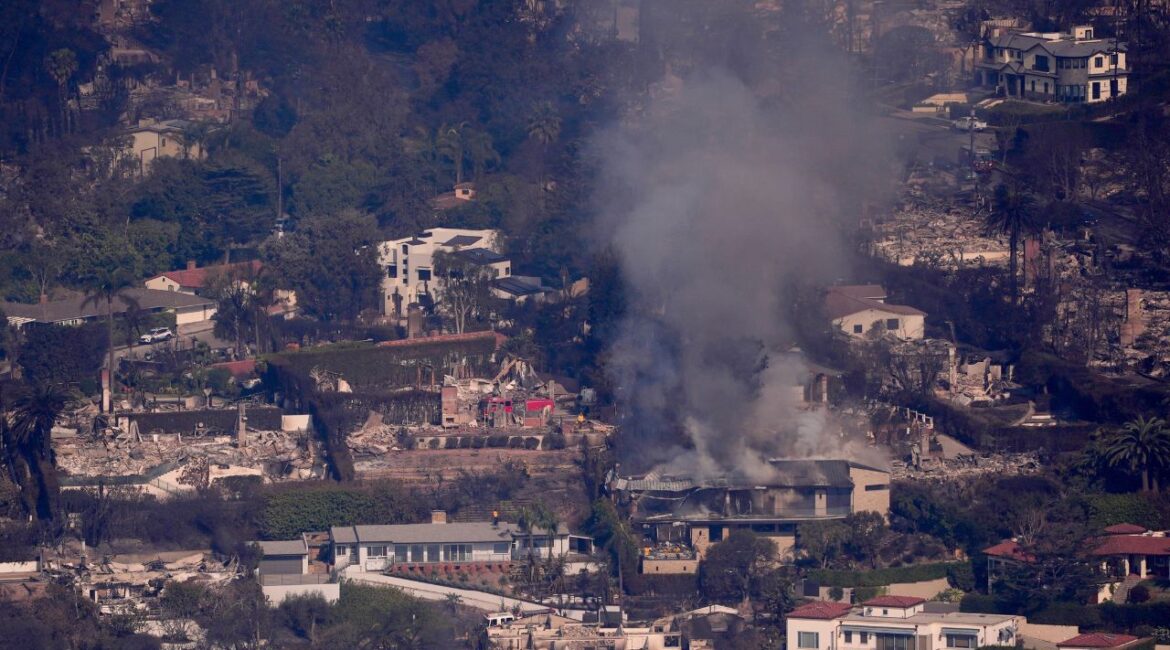 The devastation from the Palisades Fire is seen from the air in the Pacific Palisades neighborhood of Los Angeles, Thursday, Jan. 9, 2025. (AP/Mark J. Terrill)