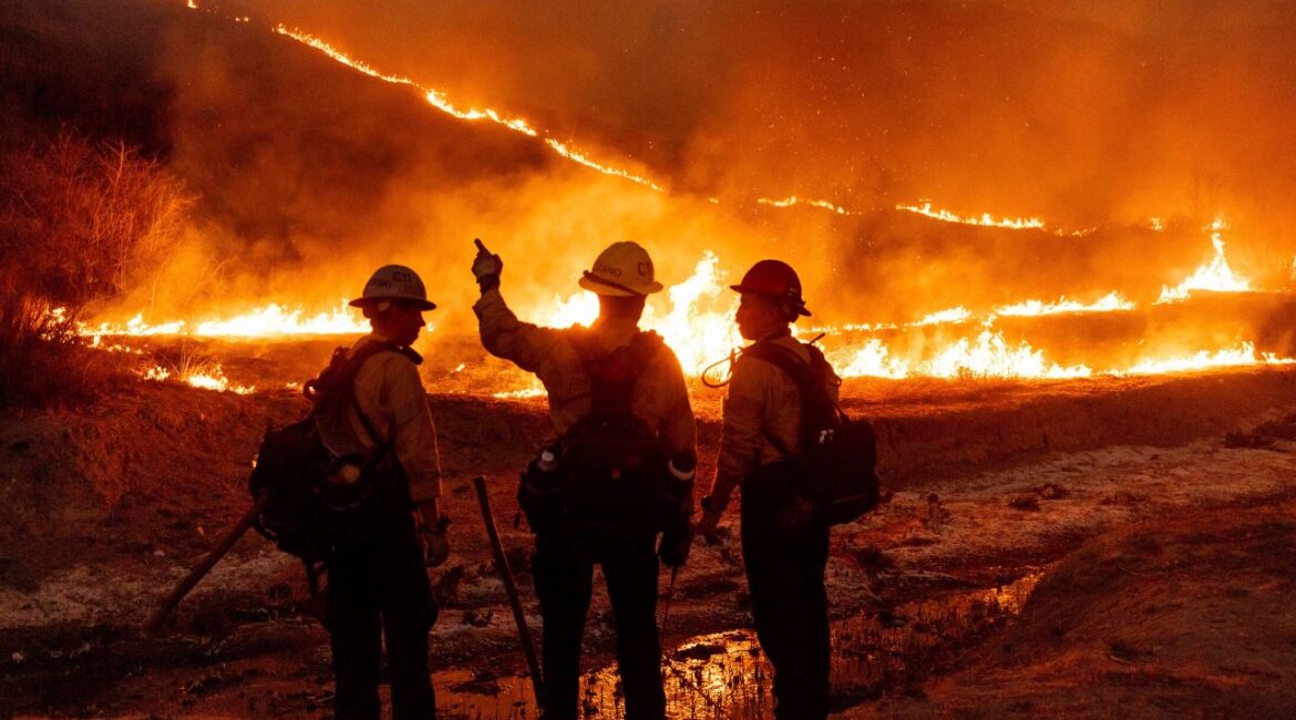 Fire crews battle the Kenneth Fire in the West Hills section of Los Angeles, Thursday, Jan. 9, 2025. (AP Photo/Ethan Swope)