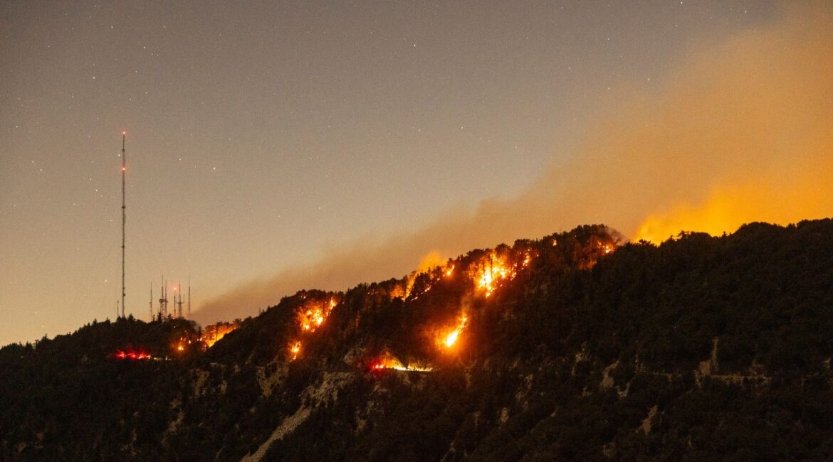 Spots of the Eaton Fire still burn after the fire swept through the mountains of the Angeles National Forest near Mount Wilson Observatory, north of Pasadena, Thursday, Jan. 9, 2025. (AP/Etienne Laurent)