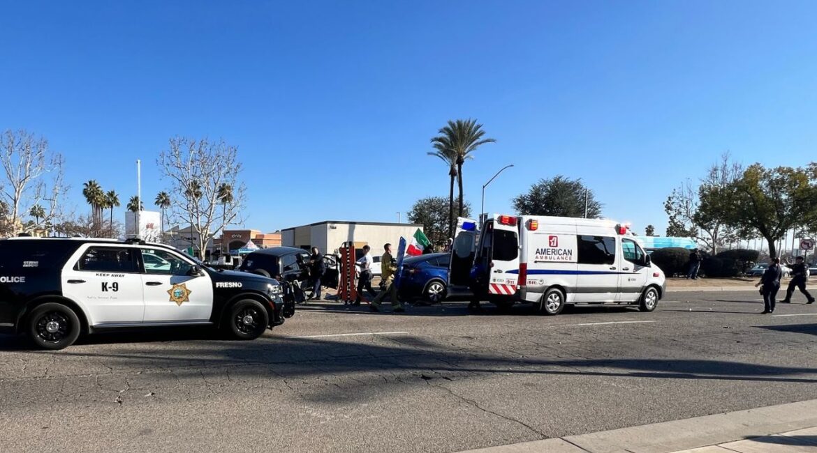 A hit-and-run collision during a deportation protest on Blackstone Avenue hospitalized two people and caused major disruptions. (GV Wire/Anthony W. Haddad)