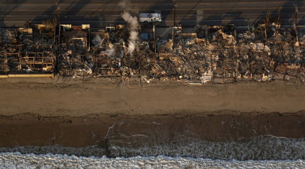 The smoldering wreckage of beachfront structures destroyed by the Palisade Fire in Malibu, Calif., on Thursday, Jan. 9, 2025. The threat of more fires propelled by blistering Santa Ana winds hung over southern California on Friday as firefighters battled to contain the raging blazes that have killed at least 10 people and destroyed thousands of structures. (Loren Elliott/The New York Times)