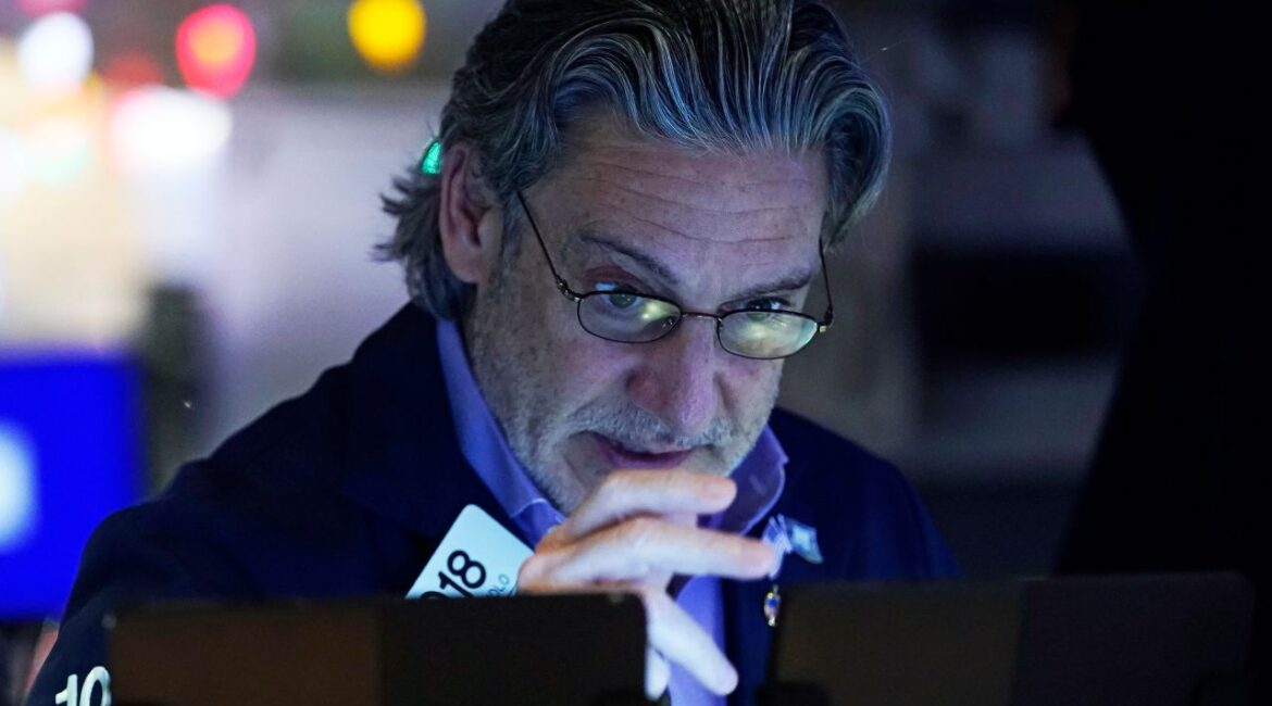 Trader John Romolo works on the floor of the New York Stock Exchange, Wednesday, Dec. 18, 2024. (AP Photo/Richard Drew)