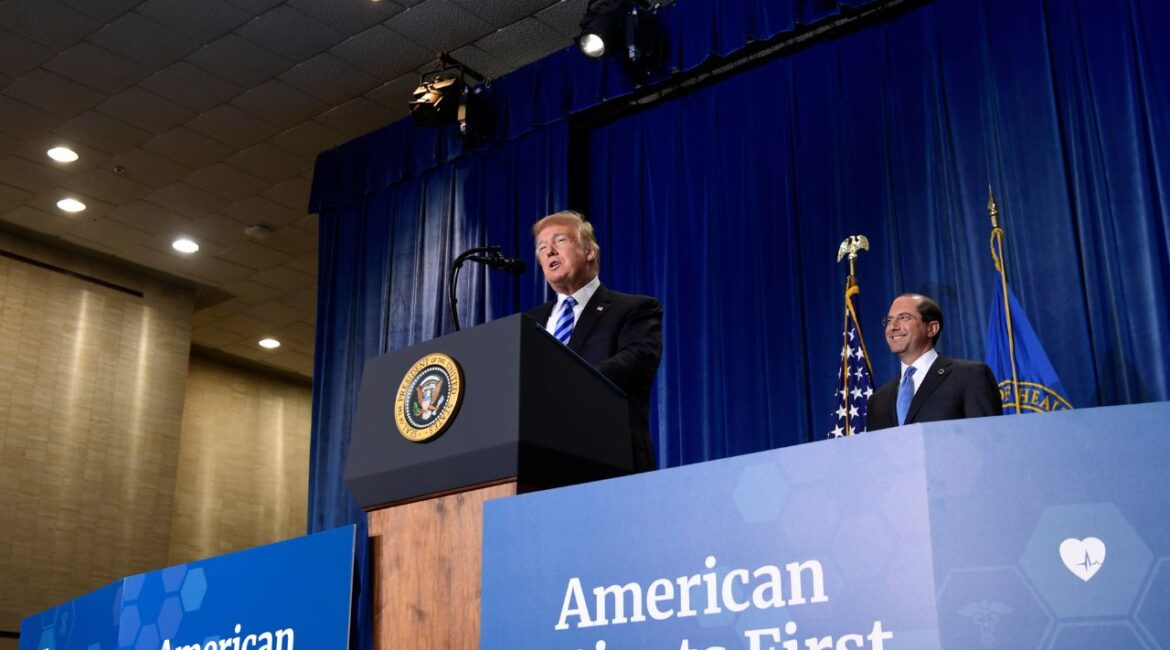 President Donald Trump talks about drug prices during a visit to the Department of Health and Human Services in Washington, Oct. 25, 2018. HHS Secretary Alex Azar listens at right. (AP File)
