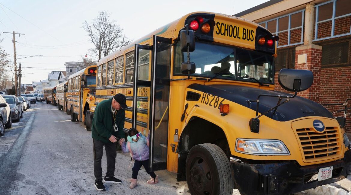 A student arrives for school Tuesday, Jan. 21, 2025, in the East Boston neighborhood of Boston. (AP Photo/Michael Dwyer)