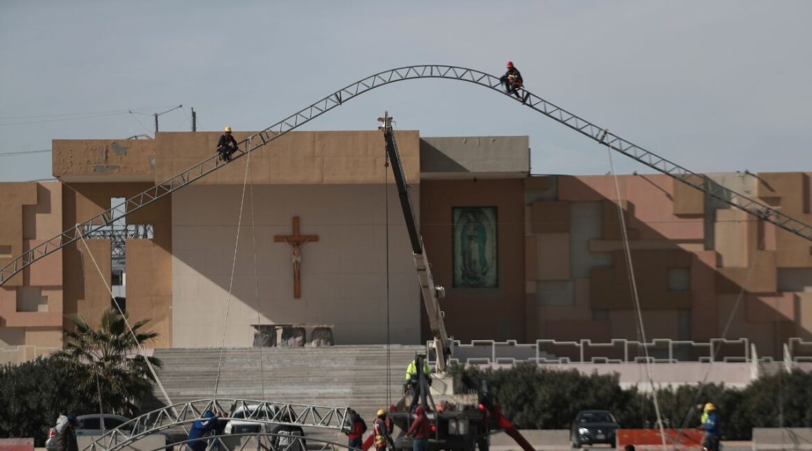 Workers begin the installation of a temporary shelter for possible deportees from the United States, in Ciudad Juarez, Mexico, Wednesday, Jan. 22, 2025. (AP/Christian Chavez)
