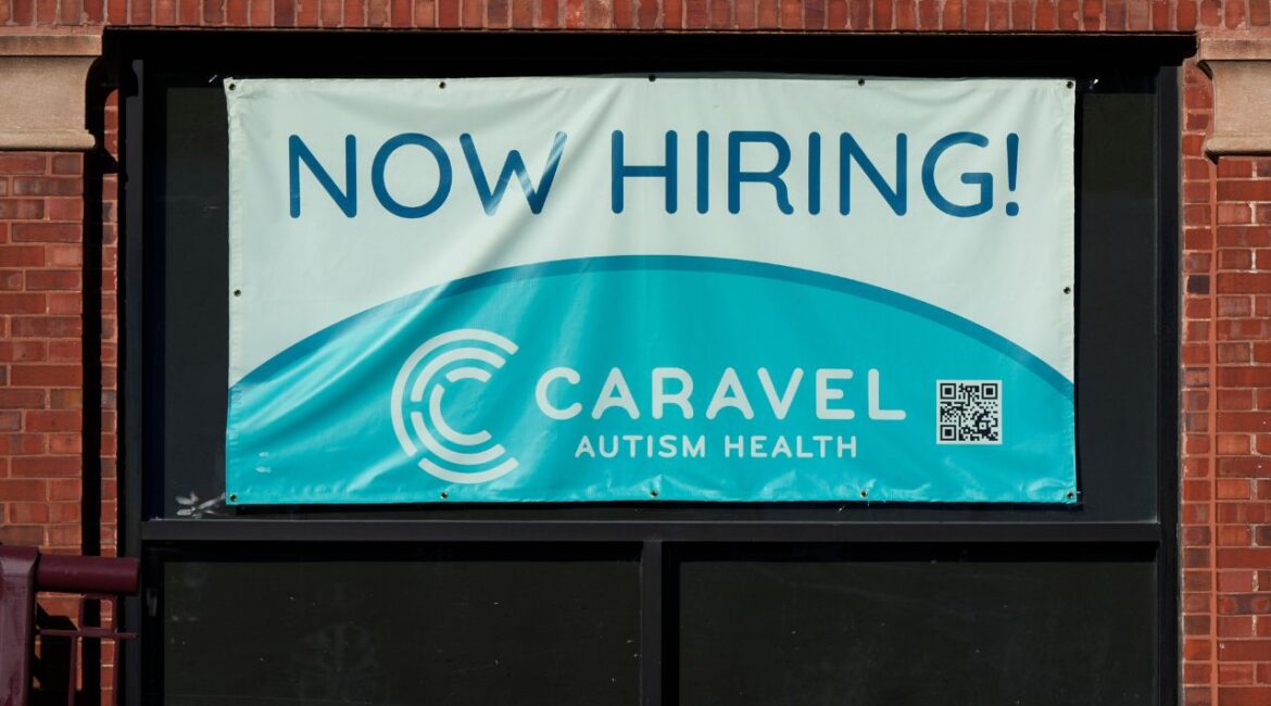 Hiring sign is displayed at a health service center in Chicago, Tuesday, Jan. 21, 2025. (AP/Nam Y. Huh)