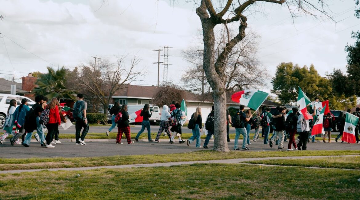 McLane and Duncan Polytechnical high school students walked out Friday, Feb. 7, 2025, to protest deportations, marching down Cedar Avenue. (GV Wire/Eric Martinez)