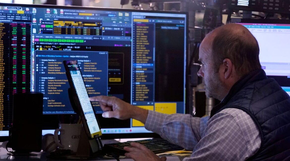 Trader Peter Mancuso works on the floor of the New York Stock Exchange, Tuesday, Feb. 4, 2025. (AP Photo/Richard Drew)