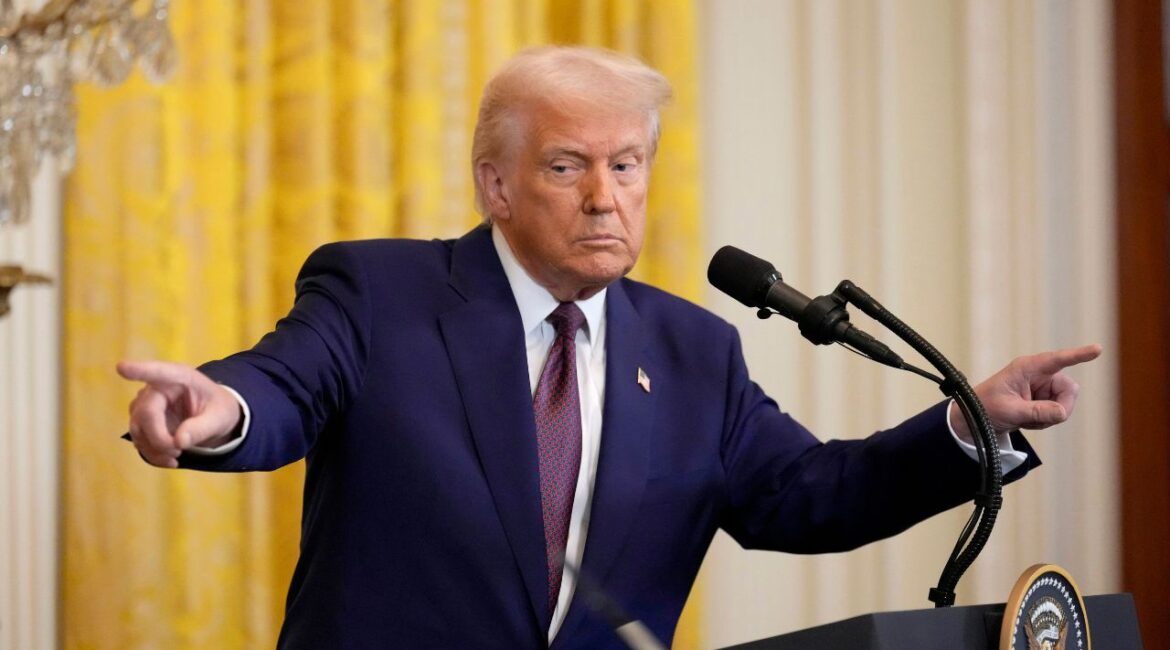 President Donald Trump points to a reporter and India's Prime Minister Narendra Modi during a news conference in the East Room of the White House, Thursday, Feb. 13, 2025, in Washington. (AP/Ben Curtis)