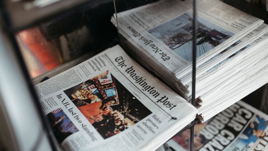 Copies of the Washington Post on a newspaper stands in New York on Jan. 23, 2024. The Washington Post’s owner, Jeff Bezos, announced a narrowing of the opinion section’s focus to defend “personal liberties and free markets,” along with word that the paper’s opinions editor, David Shipley, was resigning. (Ahmed Gaber/The New York Times)