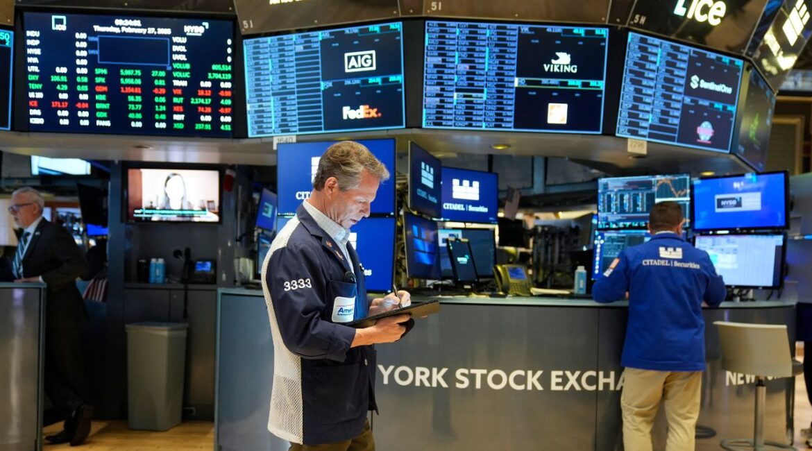 People work on the floor at the New York Stock Exchange in New York, Thursday, Feb. 27, 2025. (AP/Seth Wenig)