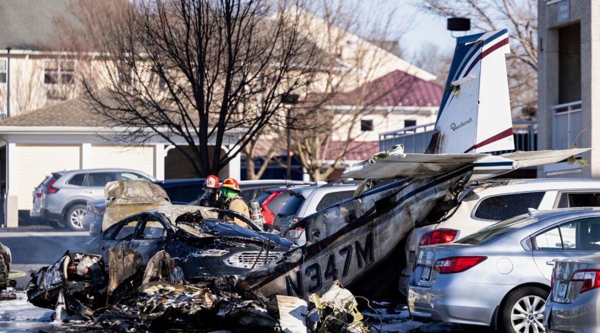 First responders work the scene after a plane crashed in the parking lot of a retirement community in Manheim Township, Pa., Sunday, March 9, 2025. (Logan Gehman/LNP/LancasterOnline via AP)
