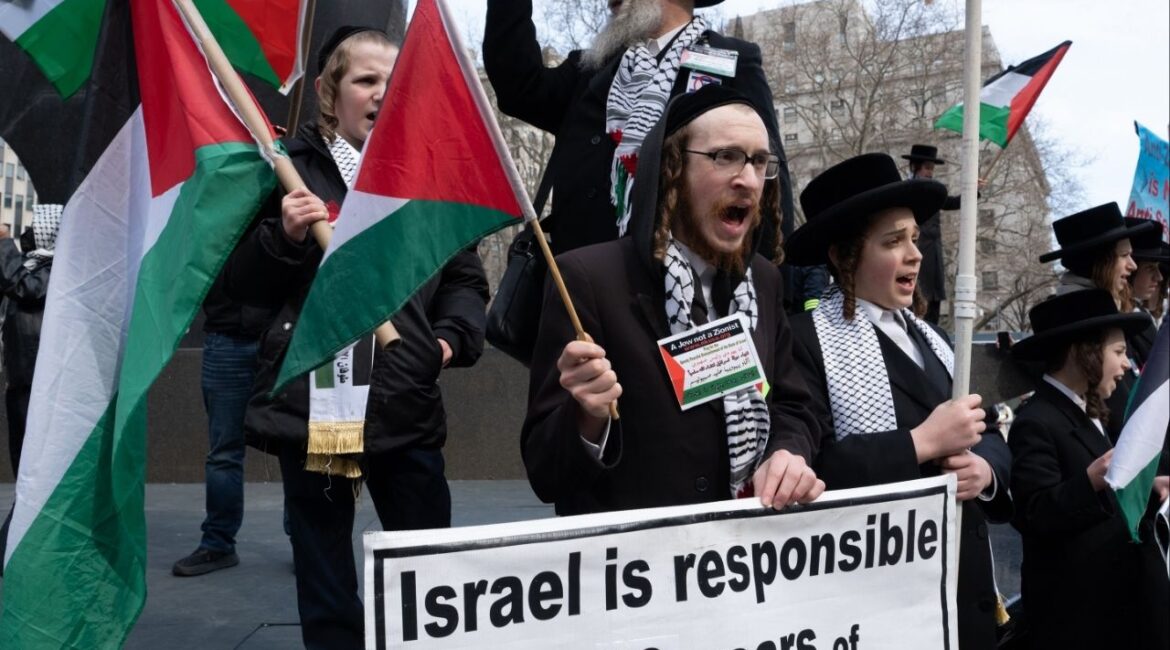 Demonstrators rally with the flag of Palestine outside the federal courthouse in lower Manhattan to protest the detention and potential deportation of Mahmoud Khalil in New York, Wednesday, March 12, 2025. Mahmoud, 30, a pro-Palestinian student activist at Columbia University, was detained by immigration agents at Columbia student housing, despite his status as a legal resident of the United States. (Juan Arredondo/The New York Times)