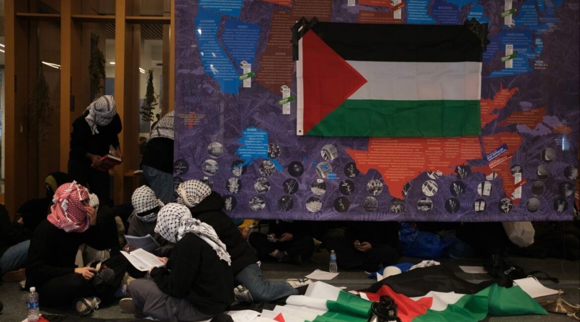 Pro-Palestinian demonstrators occupy the lobby of Barnard College’s main library in Manhattan, on Wednesday, March 5, 2025. Mahmoud Khalil was the public face of pro-Palestinian protests — officials have accused him, without providing details, of leading activities aligned with Hamas, an allegation he has denied. (Marco Postigo Storel/The New York Times)