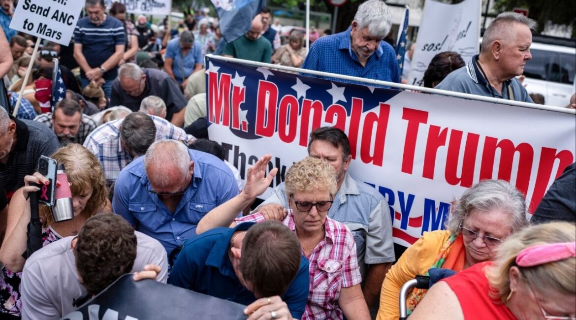 People rallied in support of US President Donald Trump outside the US embassy in Pretoria, South Africa on Feb. 15, 2025. The president and his allies accuse South Africa of discriminating against and killing white people, and warn that it could happen in America if attempts to promote diversity aren’t stopped. (Joao Silva/The New York Times)