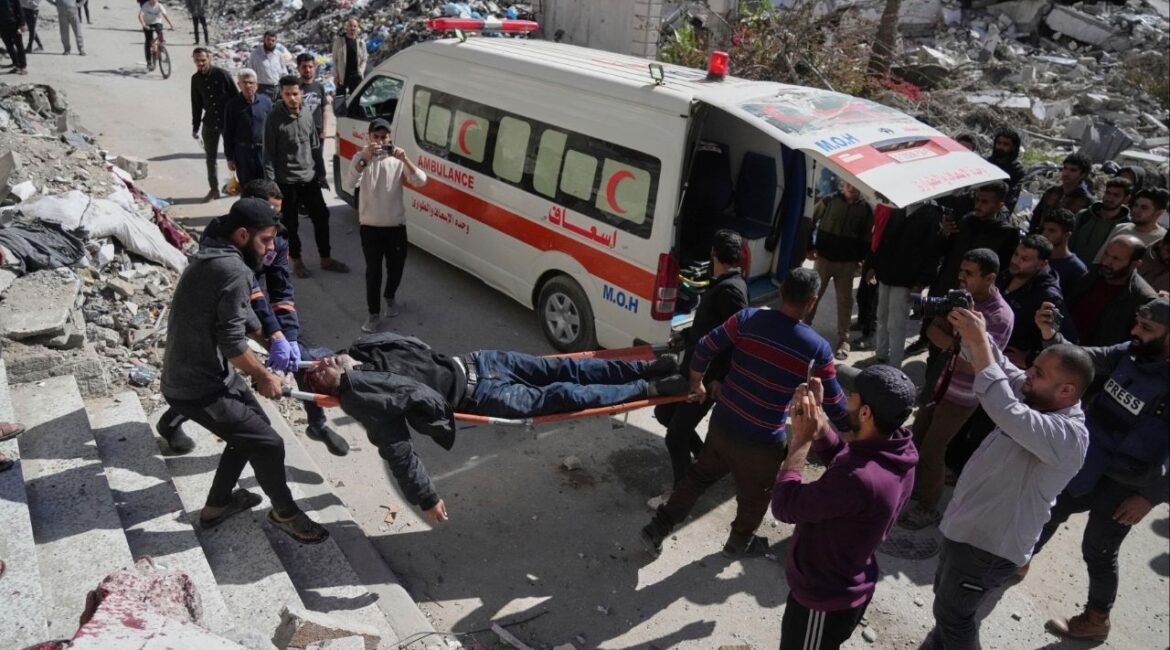 Palestinians evacuate an injured man after his house was hit by an Israeli bombardment in Gaza City, Wednesday, March 19, 2025. (AP Photo/Jehad Alshrafi)