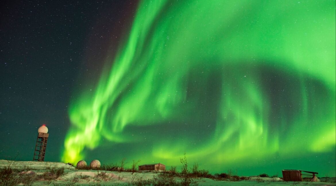 The northern lights illuminate the sky above a former Distant Early Warning radar station in the Canadian Arctic, a legacy of the Cold War in Tuktoyaktuk, Canada, Jan. 6, 2016. Canada has made a $4.2 billion deal with Australia to develop a cutting-edge radar for the Arctic that can detect hypersonic missiles and other threats over the curvature of the earth, Prime Minister Mark Carney announced on Tuesday. (Alex Welsh/The New York Times)