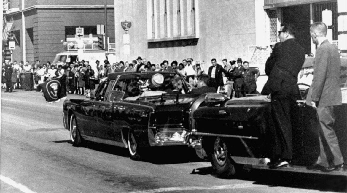 Secret servicemen standing on running boards follow the presidential limousine carrying President John F. Kennedy, right, rear seat, and first lady Jacqueline Kennedy, left, as well as Texas Gov. John Connally and his wife, Nellie, in Dallas, Texas, Nov. 22, 1963. (AP File)